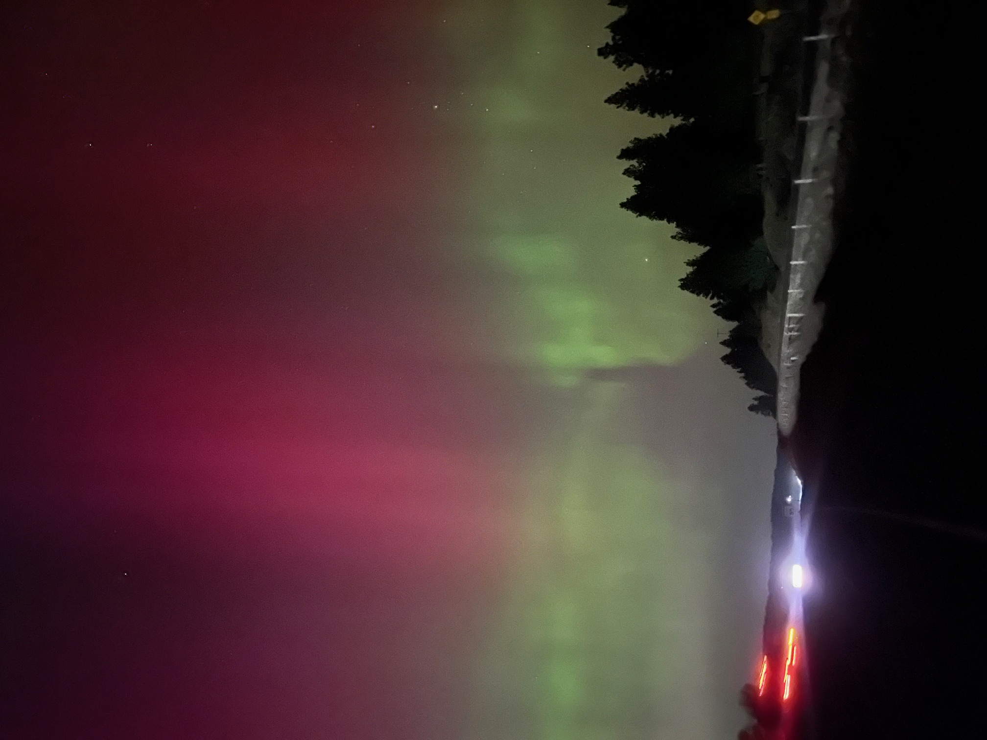 Northern lights aurora borealis visible over the First Services Group Montana ranch at night