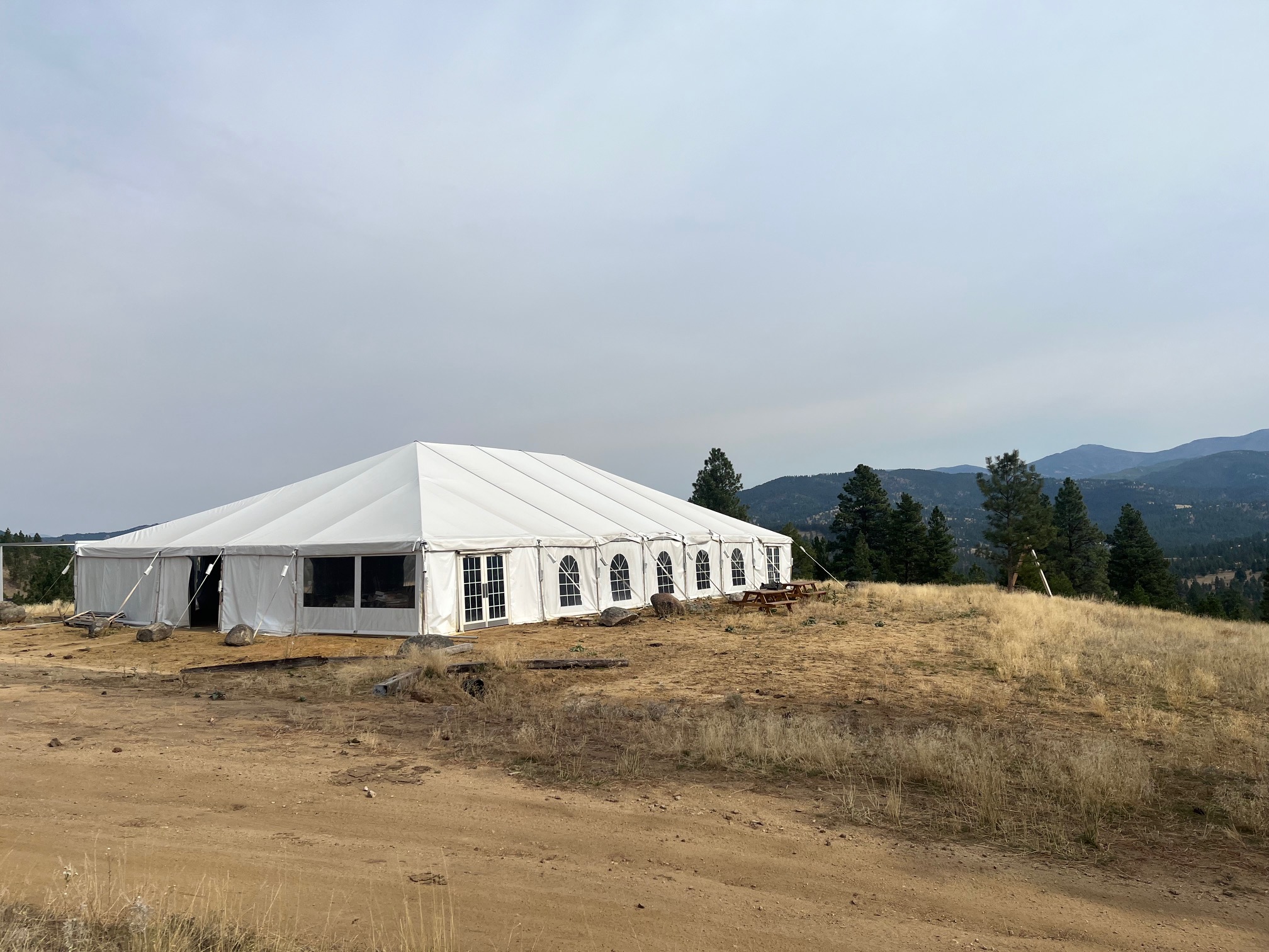 Training tent facility with Montana mountain backdrop